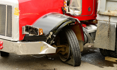 Semi driver crashes into creek, avoids serious injury